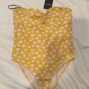 Yellow floral bodysuit with cute peek-a-boo detail